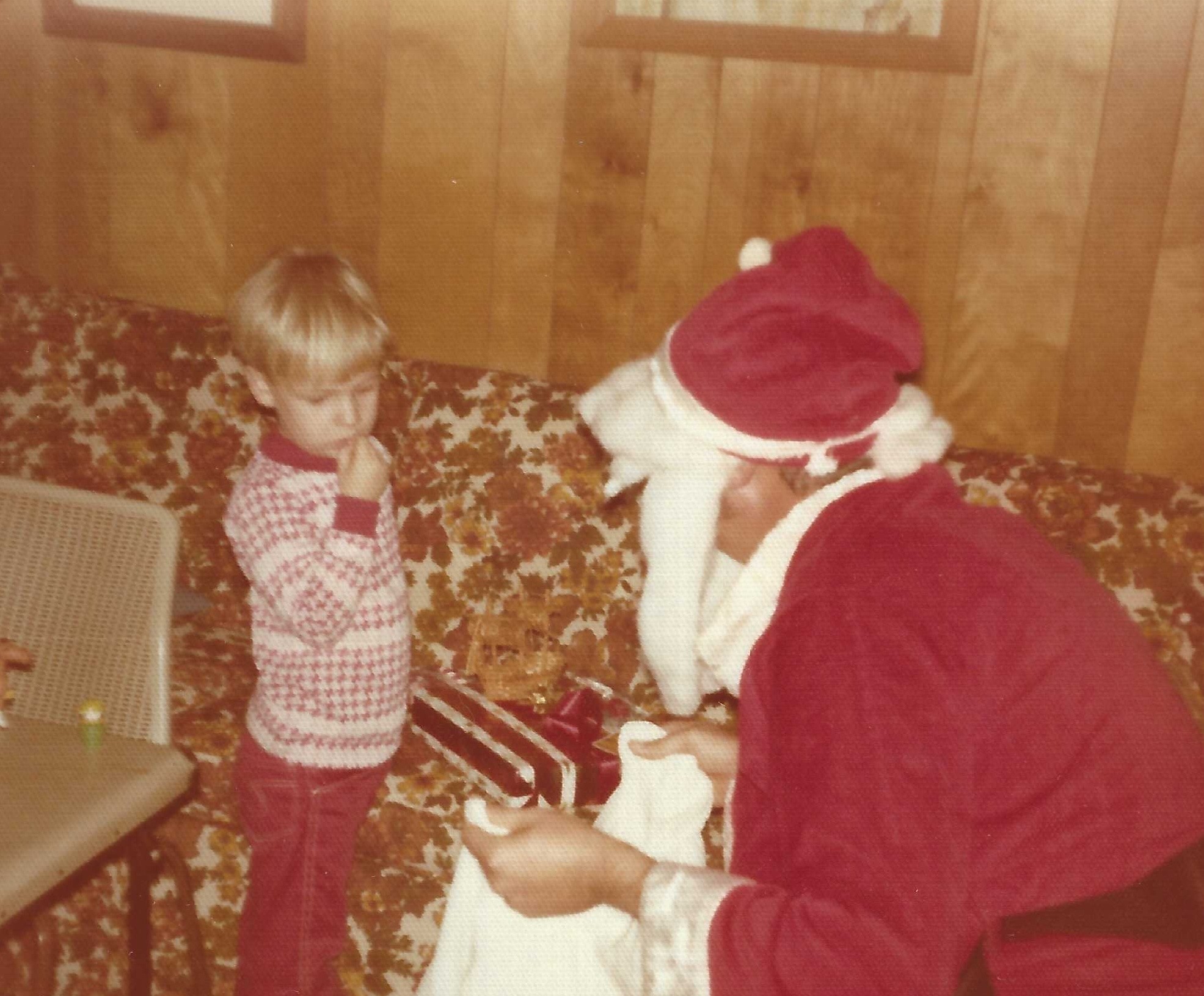 The author in the family homestead with Santa; photo courtesy of Sullivan family