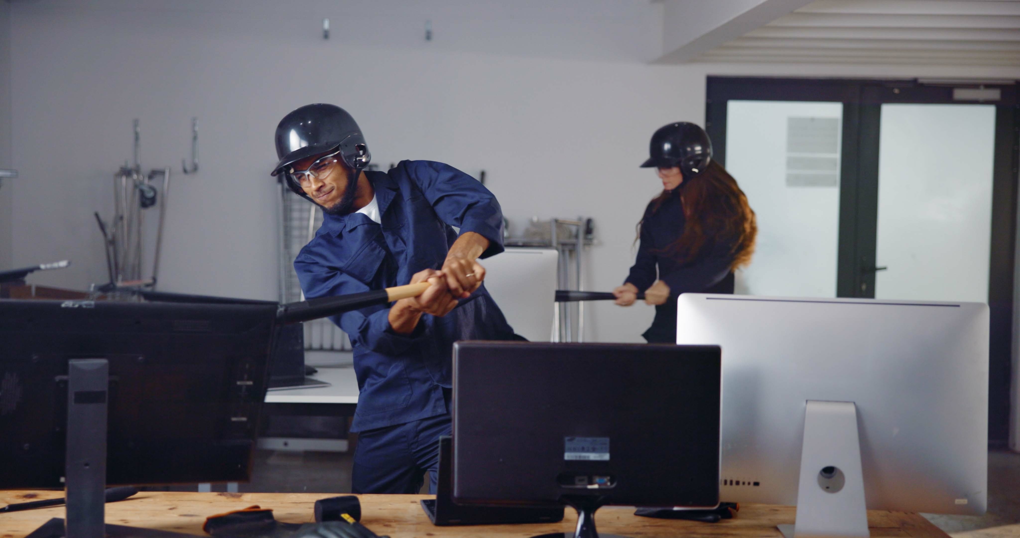 People in a rage room; photo by PeopleImages